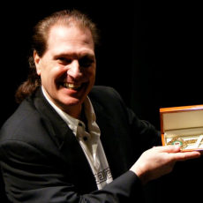 Adrian Baker, Музыкальный Портал α